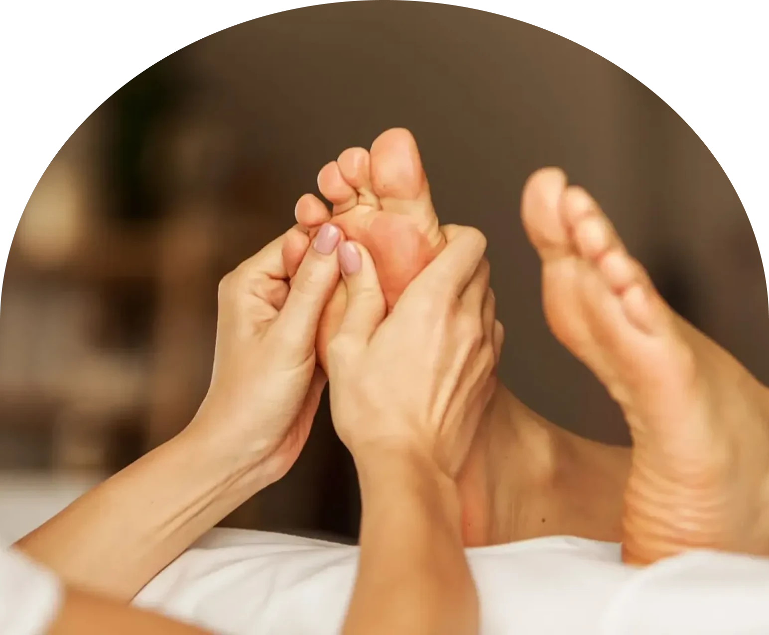 Therapist giving a relaxing foot massage to a client.