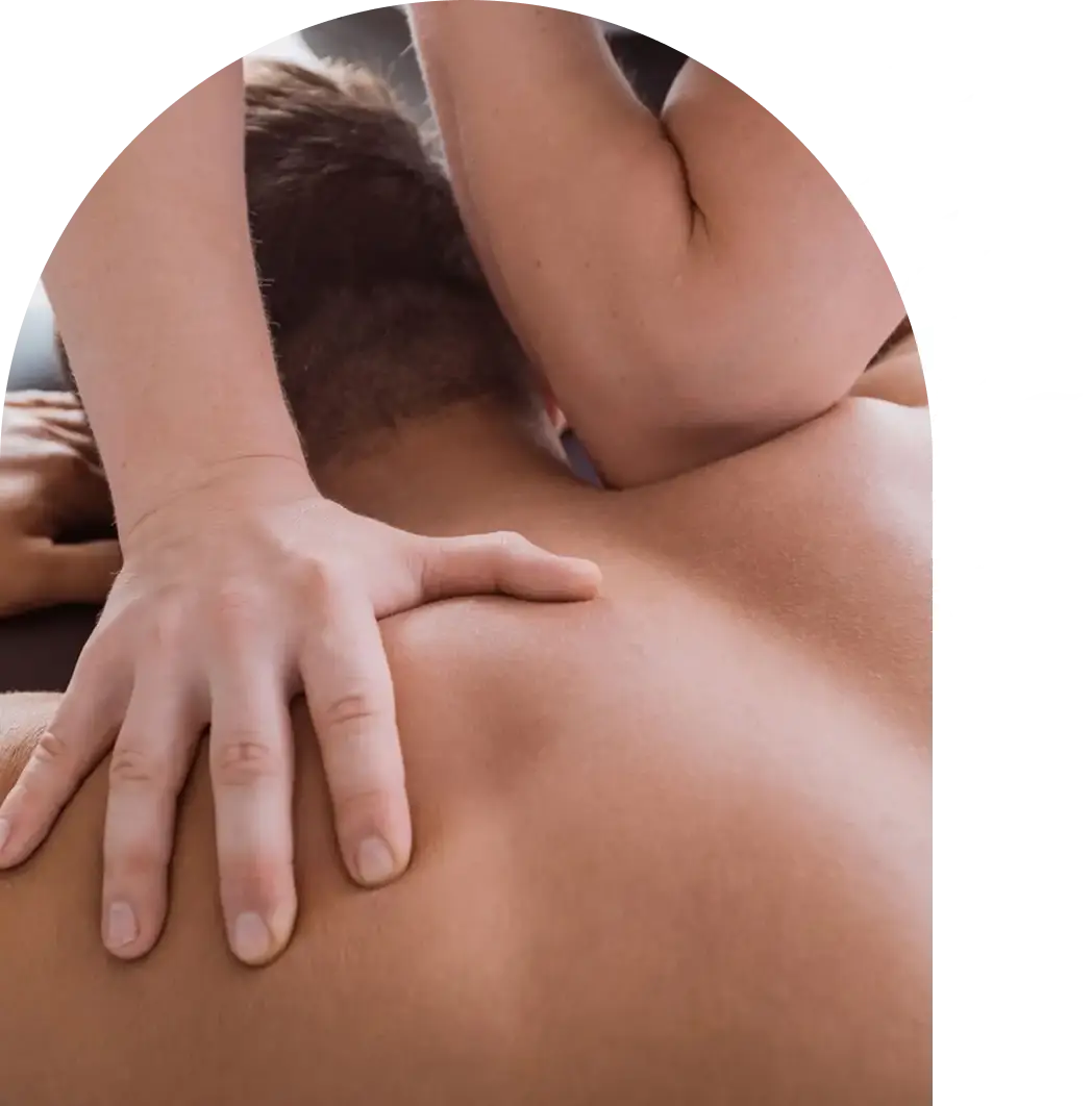 Person receiving a back massage with hands applying pressure.